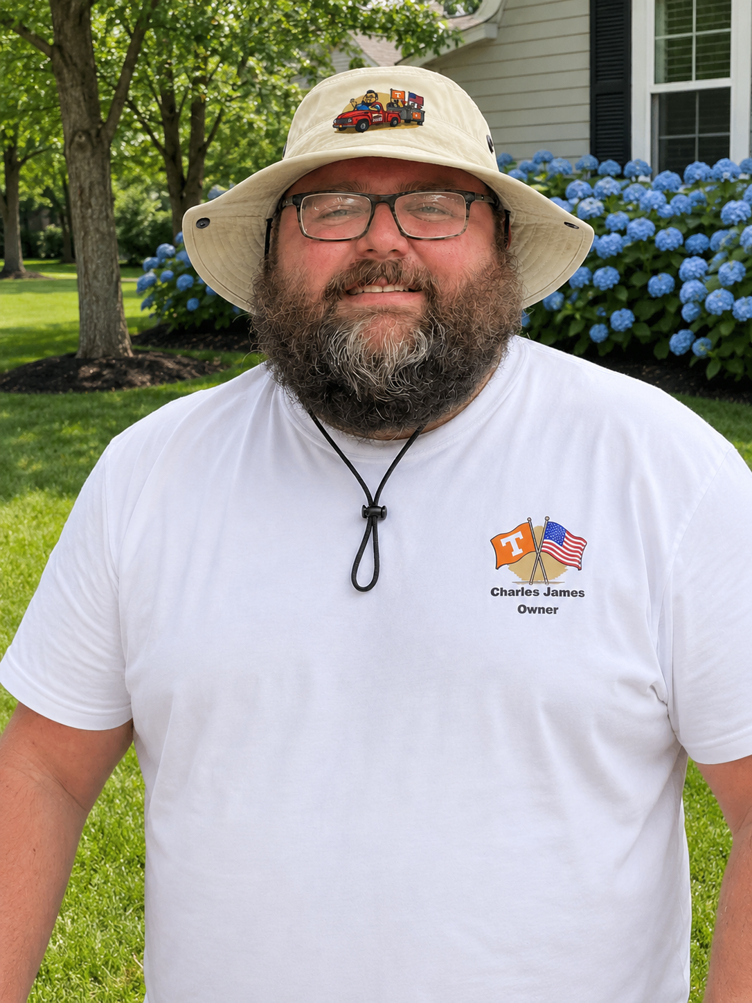 Charles James wearing the branded bucket hat and t-shirt