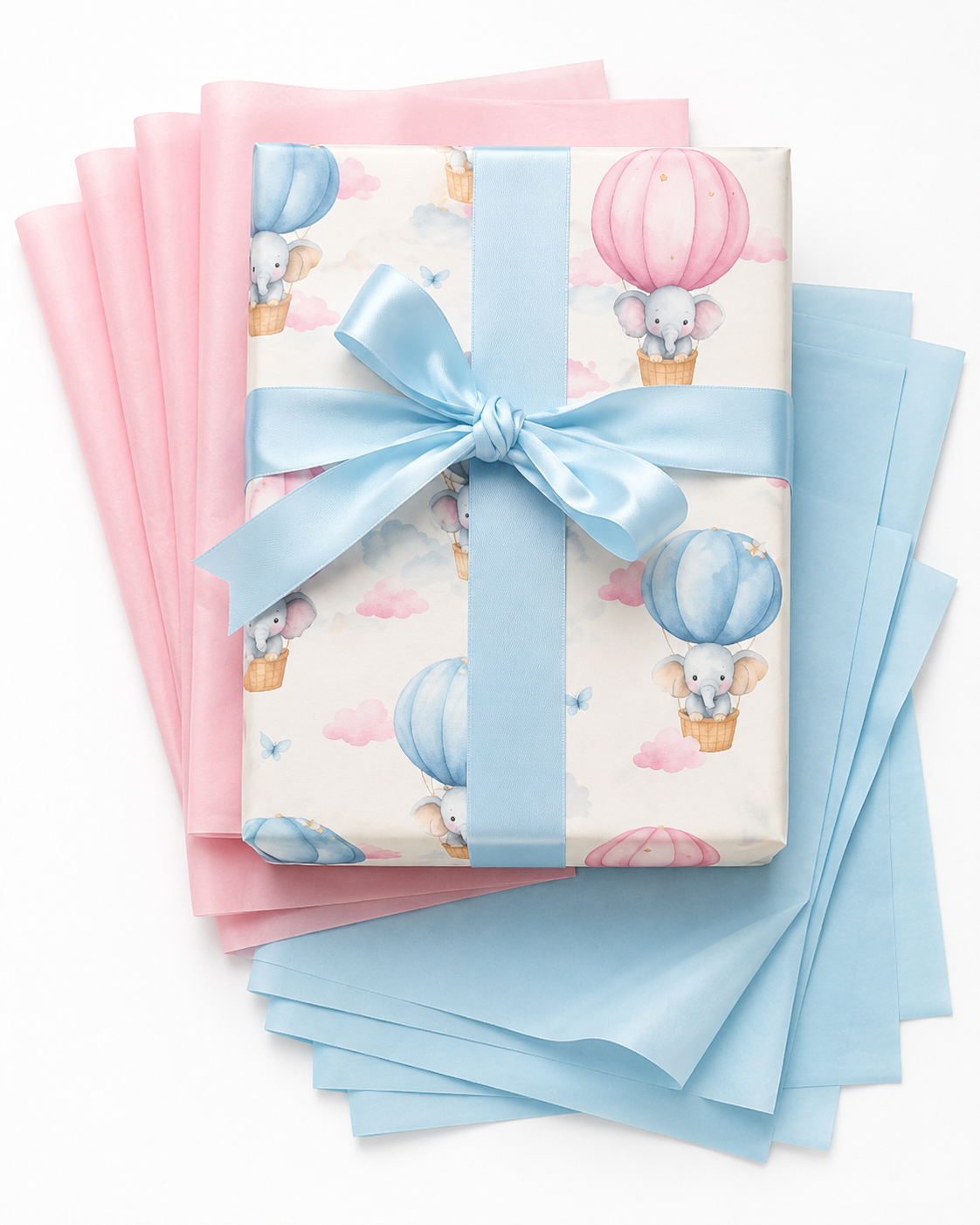 Pastel watercolor wrapping paper with elephants in hot air balloons, blue satin bow and pink and blue tissue